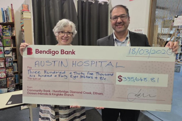 Diamond Creek Opportunity Shop Treasurer, Roslyn Gaylor, presents cheque to Austin Health Chief Financial Officer, Frank Vosnidis